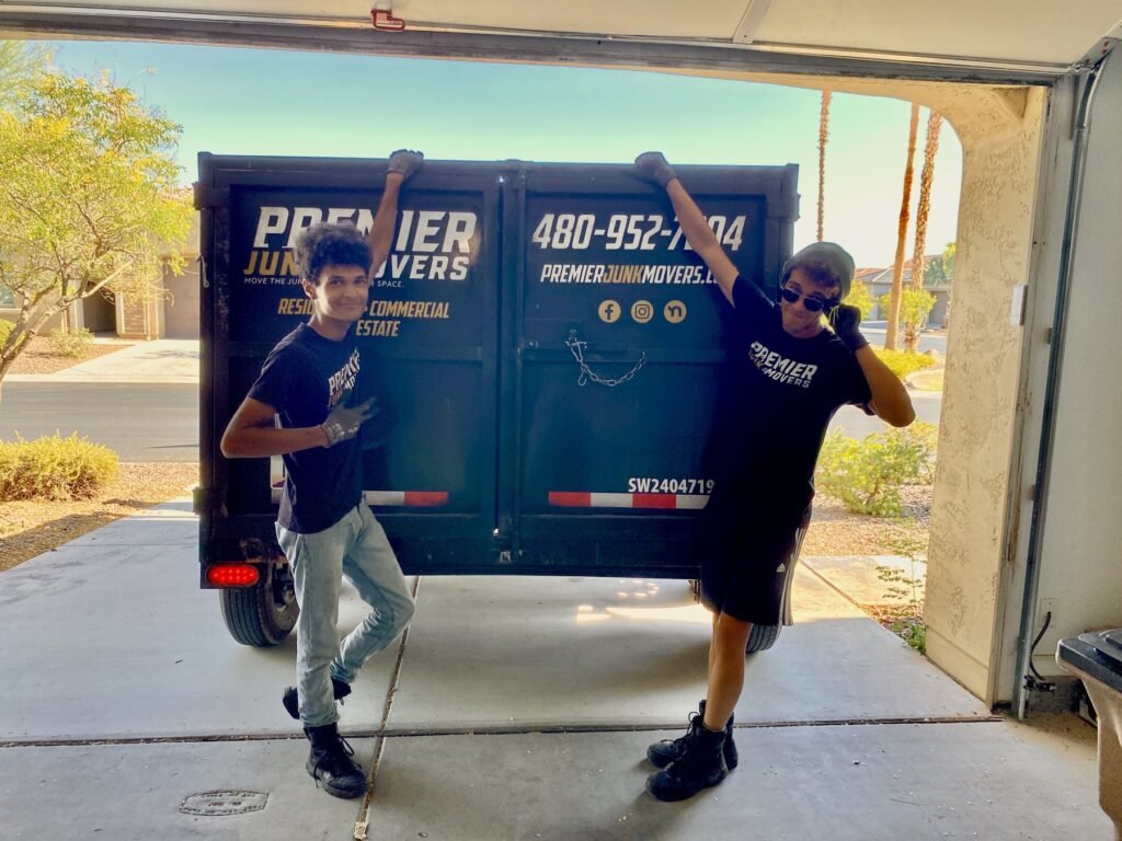 Premier Junk Movers crew with branded trailer