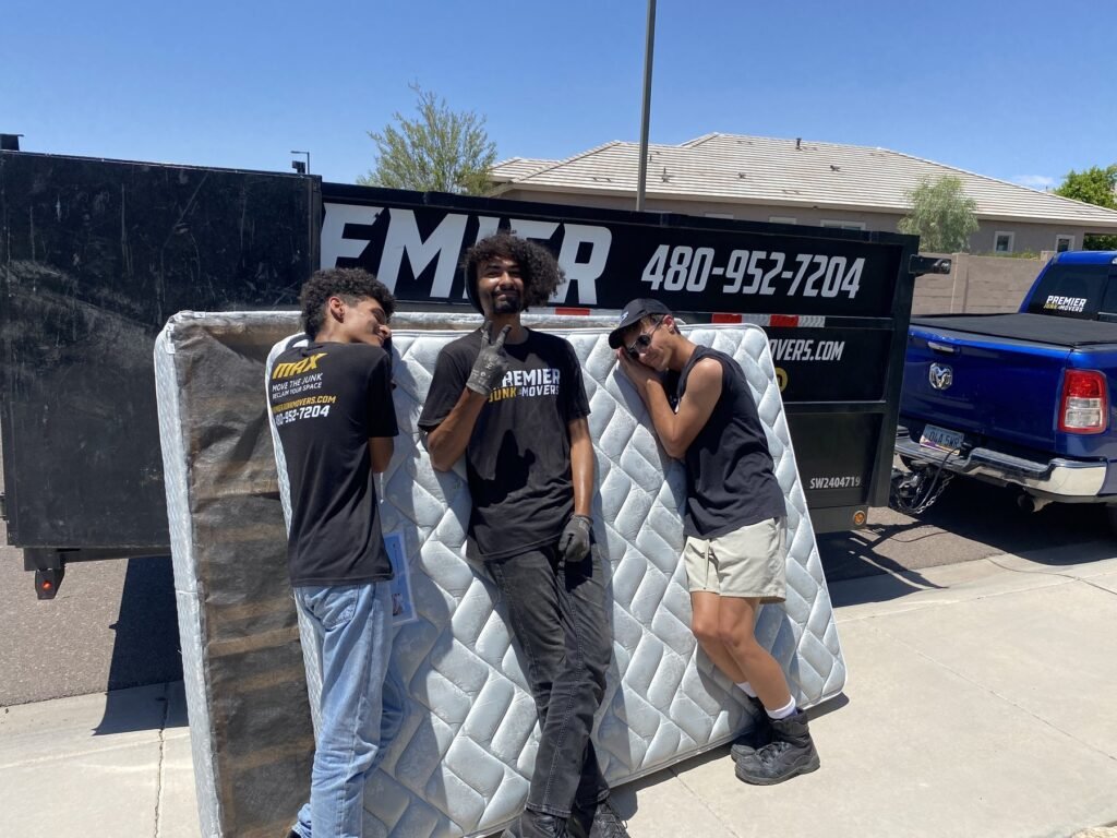 Premier Junk Movers crew with a mattress haul